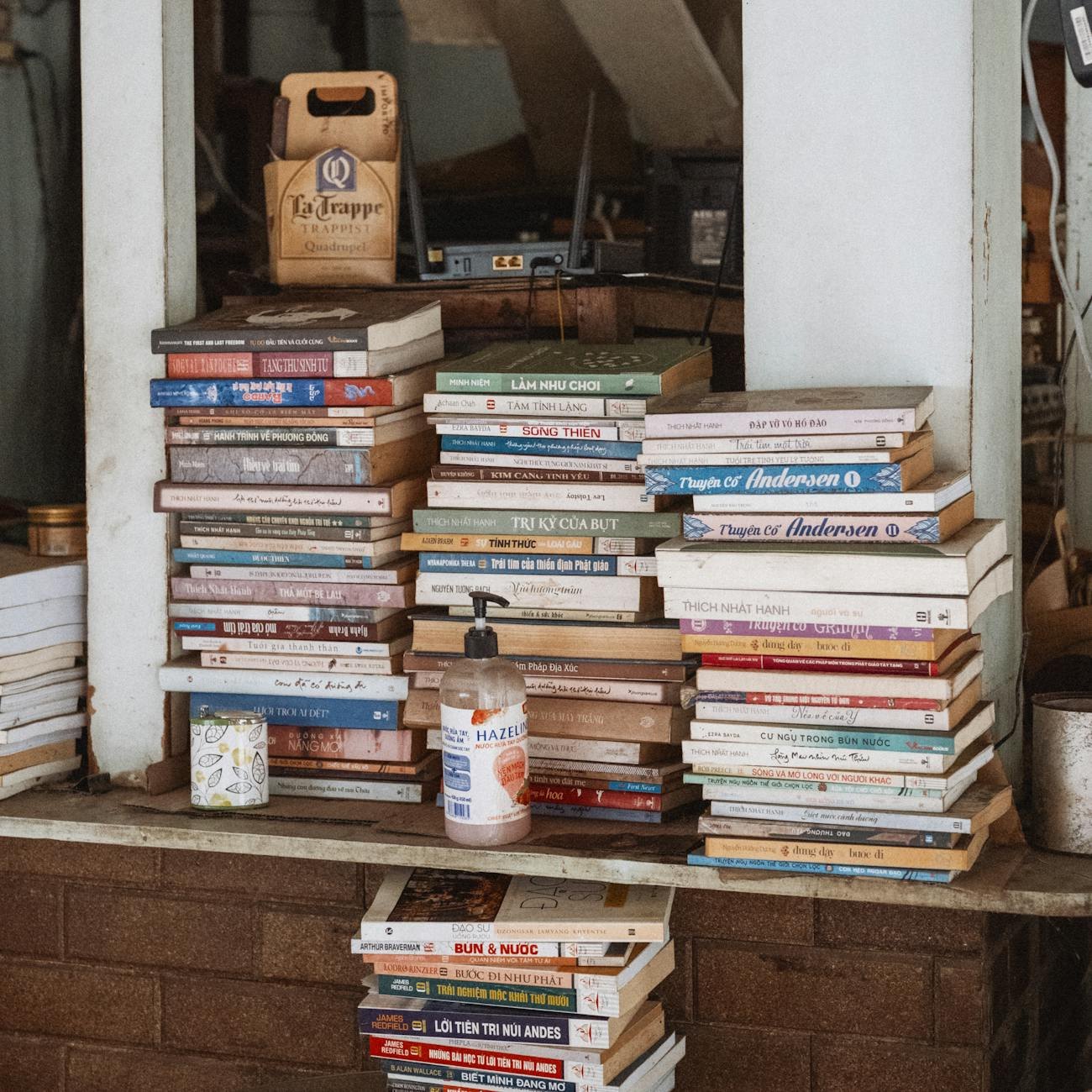 Before transformation: cluttered bookshelf with disorganized books and items